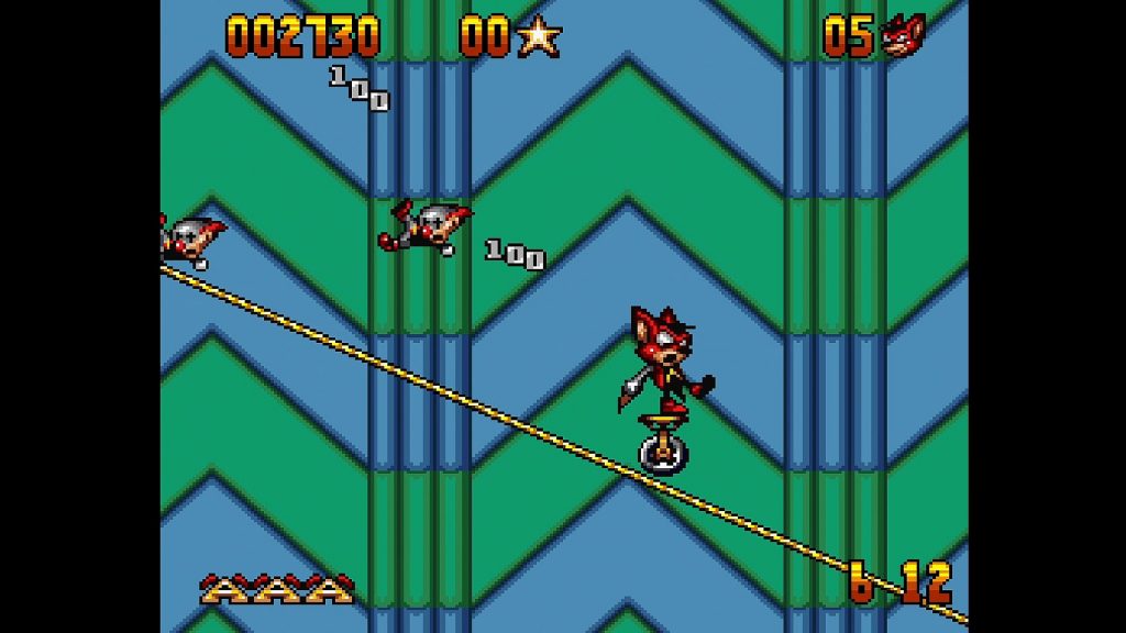 Aero the Acrobat rides a unicycle along a tightrope.